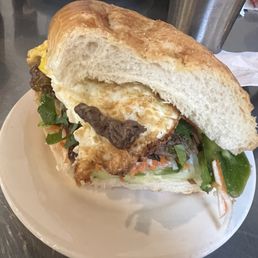 Lemongrass Steak Banh Mi with a fried egg