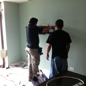 Acoustical Vision - Acoustical Vision - Paul and Pedro securing, leveling mounting - Home Theatre Installation Near Me - Forest Park, Illinois