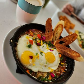 Bites & Bashes Cafe - Shakshuka with a salted caramel latte. In the background, matcha lemonade and Mediterranean omlette with tator tots. - Cafes Near Me - Lomita, California