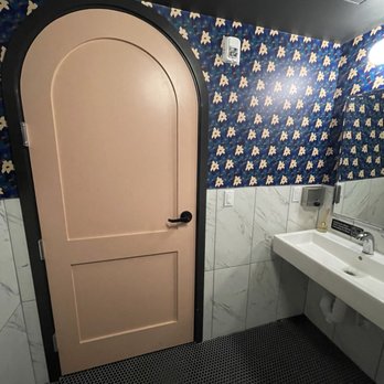 Daydreamer Coffee - Inside the bathroom. I know it might be weird to post but it was really cute (especially loved the pink doors) - Cafes Near Me - Austin, Texas