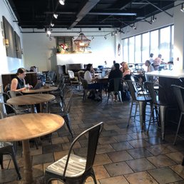 people sitting at tables in a restaurant people sitting at tables in a restaurant