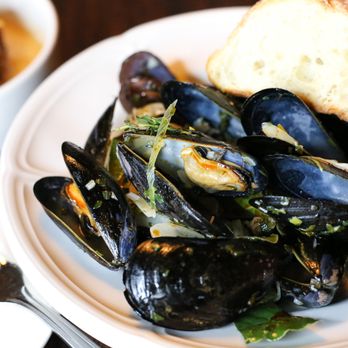 The Waterfront Hotel - a plate of mussels and bread - New American Near Me - Baltimore, Maryland The Waterfront Hotel - a plate of mussels and bread - New American Near Me - Baltimore, Maryland