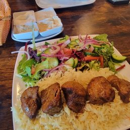 Lamb plate. The background you can see the sides that come with the pita. Lamb plate. The background you can see the sides that come with the pita.