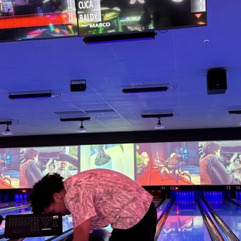 Lucky Strike Moorpark - a woman bending over to pick up a bowling ball - Bowling Near Me - Moorpark, California Lucky Strike Moorpark - a woman bending over to pick up a bowling ball - Bowling Near Me - Moorpark, California