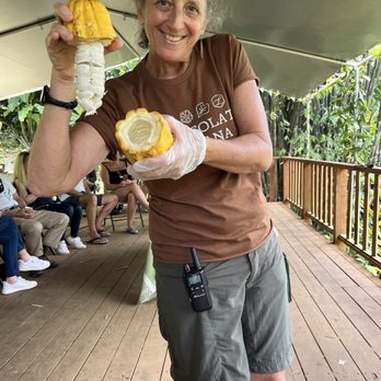 Lydgate Farms - Our wonderful guide Sheri at the second stop sharing cacao fruit. - Botanical Gardens Near Me - Kapaa, Hawaii Lydgate Farms - Our wonderful guide Sheri at the second stop sharing cacao fruit. - Botanical Gardens Near Me - Kapaa, Hawaii