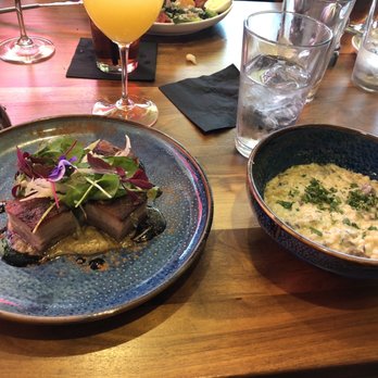 Crave Kitchen & Bar - Pork belly with huckleberry drizzle and a side order of mushroom couscous....YUM!!! Oh, and lest not forget bottomless mimosas! - Bars Near Me - Eagle, Idaho
