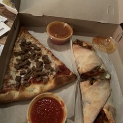 Ossining Pizzeria and Restaurant - Sad meatball slice on the left and delicious chicken roll on the right. I always ask for an extra sauce for the chicken roll!