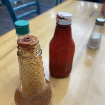 Miches De La Baja - Gross condiment bottles. Sticky and funky on tops. Looked like they've been reused. - Mexican Near Me - Riverside, California Miches De La Baja - Gross condiment bottles. Sticky and funky on tops. Looked like they've been reused. - Mexican Near Me - Riverside, California