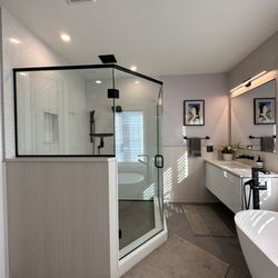Skydell Contracting Inc. - Custom shower with quartz walls, tile floor and recessed rain shower.