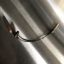 This is a burned wire there was a cobweb in the pipe blowing the flames back inside the heater This is a burned wire there was a cobweb in the pipe blowing the flames back inside the heater