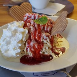 "Spaghettieis", vanilla ice cream with strawberry sauce & waffles. It comes with coconut shreddings but I asked for none. Delicious.