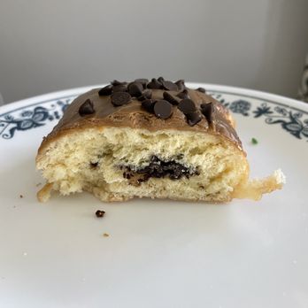 SloDoCo Donuts - An example of the small amount of filling in every donut I've ever had. Good taste but give me more filling please! - Donuts Near Me - San Luis Obispo, California