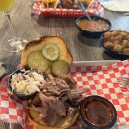 Pulled pork sandwich, fried okra, brisket tacos, baked beans, jalapeño hush puppies Pulled pork sandwich, fried okra, brisket tacos, baked beans, jalapeño hush puppies