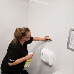 Stan's Office & Window Cleaning Service - Patti cleaning restrooms at one of our commercial accounts.