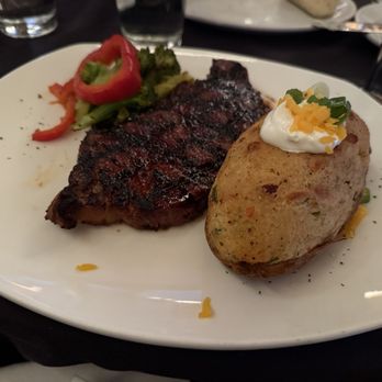 Bastien's - 10 oz NY Strip with sugar steak rub and twice baked potato. Yum!! - Steakhouses Near Me - Denver, Colorado