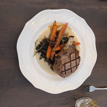 Cella Restaurant & Bar - Pork Chop with Spinach & Carrots - New American Near Me - Monterey, California