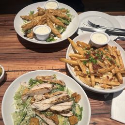 (Bottom to top) Chicken Cesar salad, FULLY LOADED CHEESE FRIES, Zinger Salad with honey mustard dressing. (Bottom to top) Chicken Cesar salad, FULLY LOADED CHEESE FRIES, Zinger Salad with honey mustard dressing.