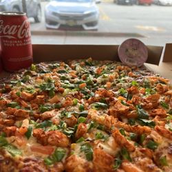 Pizza 64 - Tandoori chicken pizza half and other half is pesto veggie pizza