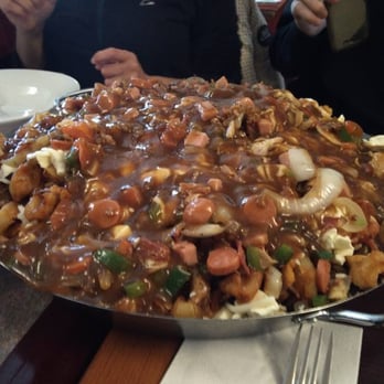 Poutineville - 15 pounds of poutine (photocred: Dave) - Poutineries Near Me - Montreal, Quebec Poutineville - 15 pounds of poutine (photocred: Dave) - Poutineries Near Me - Montreal, Quebec