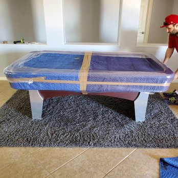 Five Star Moving - Ben wrapping table - Movers Near Me Five Star Moving - Ben wrapping table - Movers Near Me