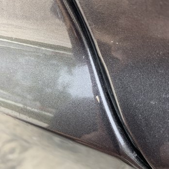 Tint World - Grass underneath the film - Car Stereo Installation Near Me - Austin, Texas