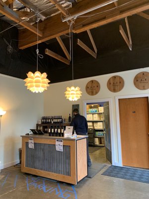 Photo of Baer Winery - Woodinville, WA, US. a man standing at the counter