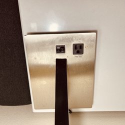 Holiday Inn Express & Suites Lawrenceville - Rusted and pitted lamp base on stained nightstand December 2022