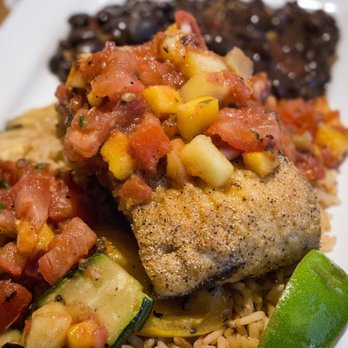 Los Cabos Cantina & Grill - Caribbean Mahi-Mahi. Lightly dredged filets, topped with a warm tropical salsa on a bed of Spanish rice. - Mexican Near Me - Whitby, Ontario Los Cabos Cantina & Grill - Caribbean Mahi-Mahi. Lightly dredged filets, topped with a warm tropical salsa on a bed of Spanish rice. - Mexican Near Me - Whitby, Ontario