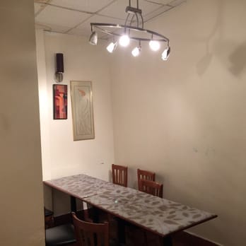 Jumbo Chinese Kitchen - a dining room with a table and chairs - Chinese Near Me - New York, New York Jumbo Chinese Kitchen - a dining room with a table and chairs - Chinese Near Me - New York, New York