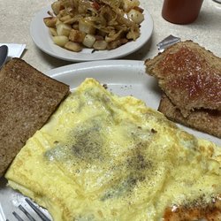 Penny's Place - Mushroom and cheese omelette with side of home fries.