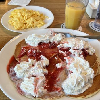 Pig 'N Pancake - Gluten friendly pancakes, with strawberry compote and whipped cream, a side of scrambled eggs and orange juice. - New American Near Me - Cannon Beach, Oregon Pig 'N Pancake - Gluten friendly pancakes, with strawberry compote and whipped cream, a side of scrambled eggs and orange juice. - New American Near Me - Cannon Beach, Oregon