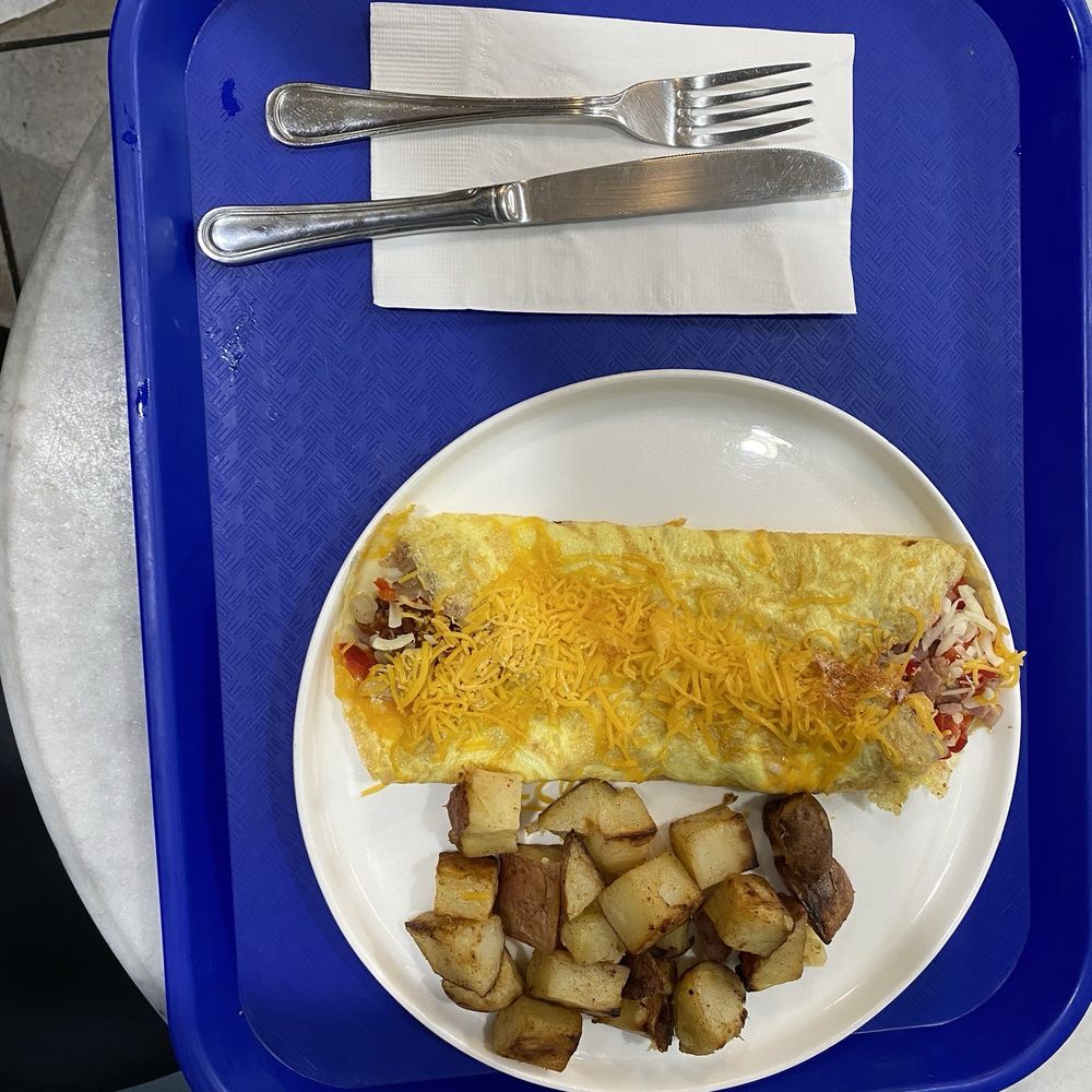 Le Bon Cafe - A custom Breakfast Create Your Own Omelette with cheese on top. Was filling and delicious. - Coffee & Tea Near Me - Washington, DC, District of Columbia