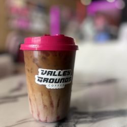 Valley Grounds Coffee - Iced blueberry oatmilk latte.