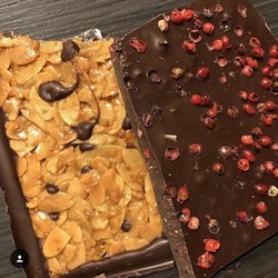 Laderach - Left: Dark chocolate with almonds and right: dark chocolate with strawberries and red pepper