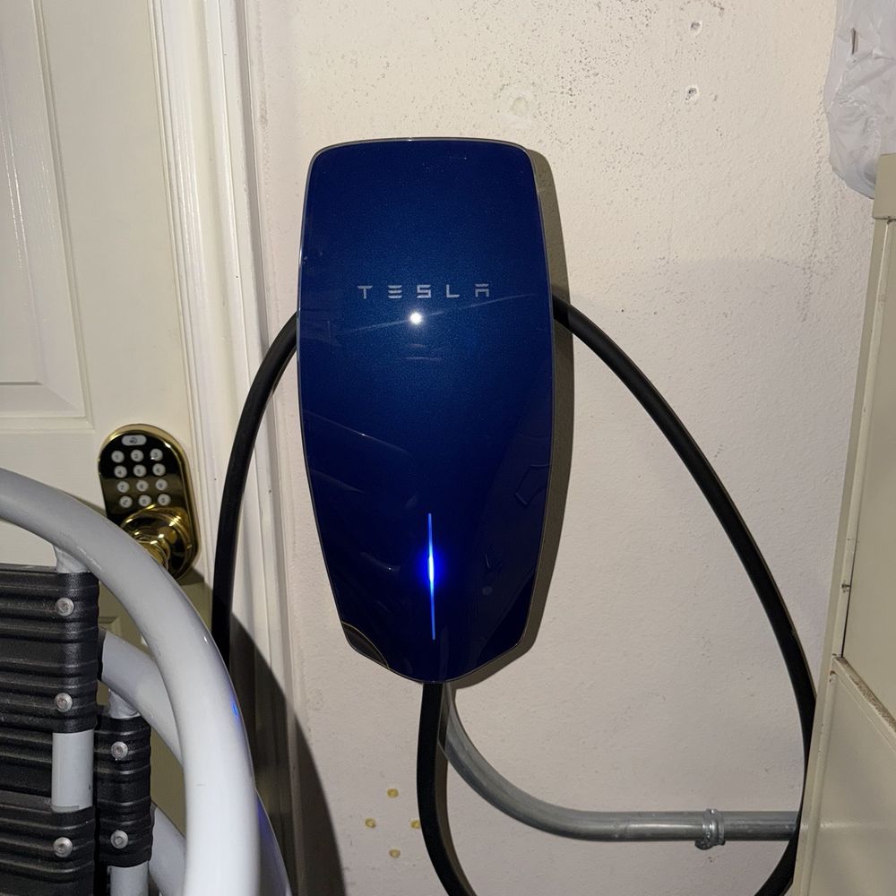 Tesla universal charger with blue faceplate. Tesla universal charger with blue faceplate.