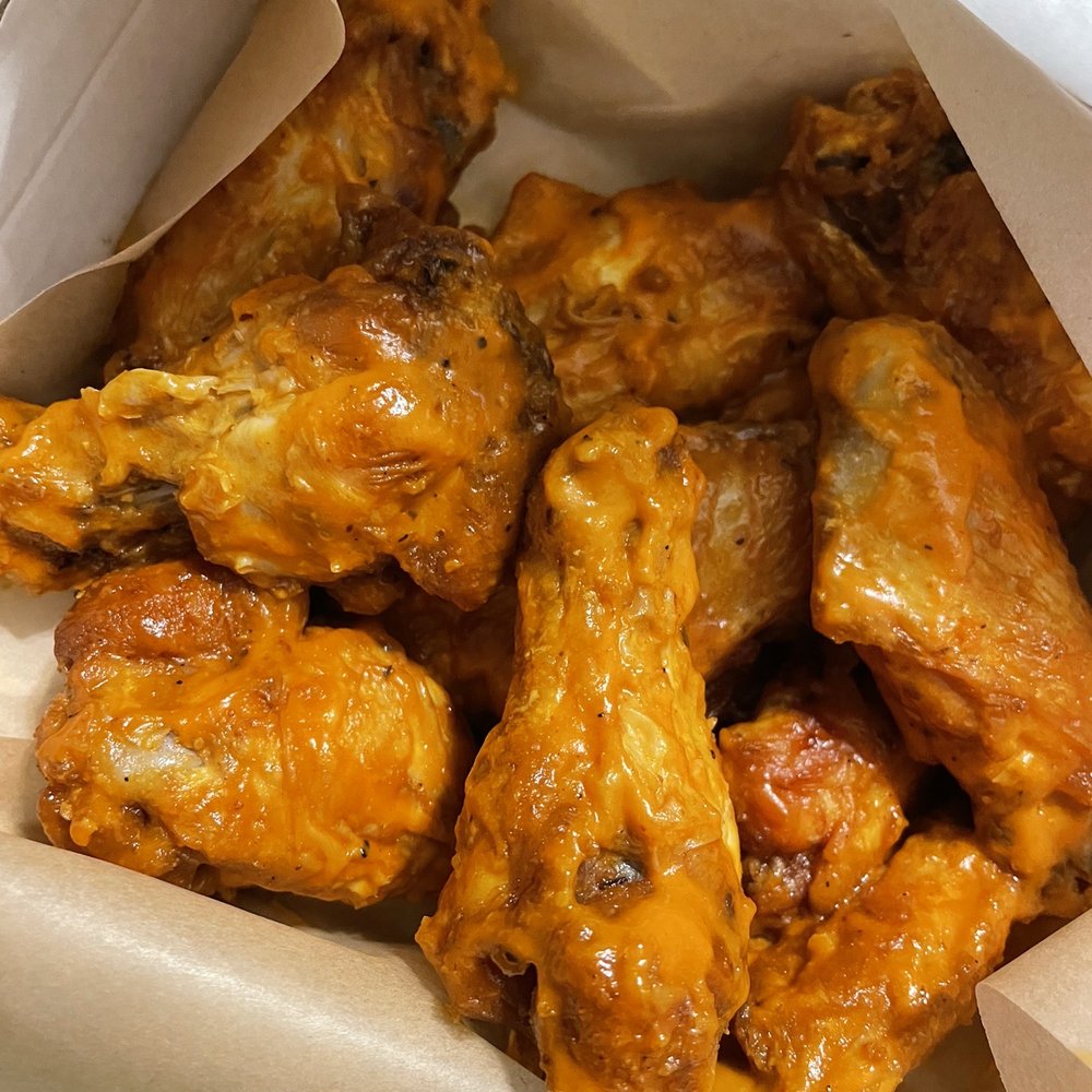 Spicy Garlic wings, they replaced my 5 with 12!