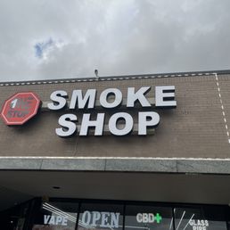Exterior outside entrance of One Stop Smoke Shop - Outside signage - Houston, Texas Exterior outside entrance of One Stop Smoke Shop - Outside signage - Houston, Texas