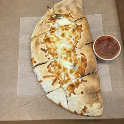Niko's Place Roast Beef, Seafood & Pizza - Large chicken Chicken Cutlet Parm Calzone