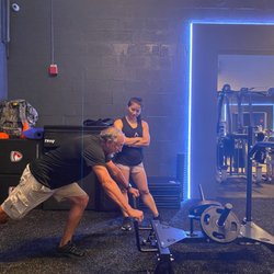 Grey Team - Trish Phan working on leg strength and core stability with Steve a retired Navy Sub Operator.