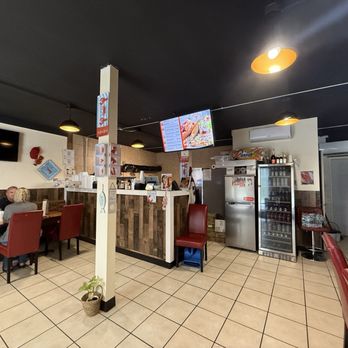 The Lobster Cage - Dining tables and the kitchen - Seafood Near Me - Pensacola, Florida The Lobster Cage - Dining tables and the kitchen - Seafood Near Me - Pensacola, Florida