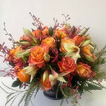 Elegant Flower Studio - Fall Arrangement with actual persimmons throughout. - Florists Near Me Elegant Flower Studio - Fall Arrangement with actual persimmons throughout. - Florists Near Me