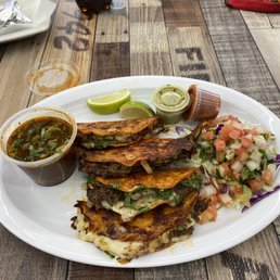 Birria tacos with dipping sauce Birria tacos with dipping sauce