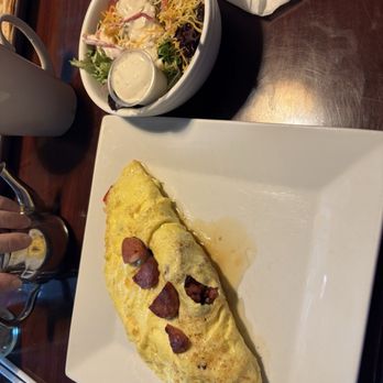 The Paper Mill Restaurant - Rise and Swine omelette with a side salad. - Breakfast & Brunch Near Me - Mt. Juliet, Tennessee The Paper Mill Restaurant - Rise and Swine omelette with a side salad. - Breakfast & Brunch Near Me - Mt. Juliet, Tennessee