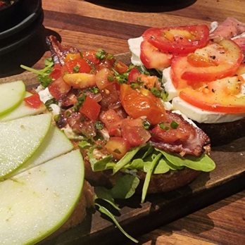 Postino Heights - Bruschetta Board 1.Brie, apple, & fig spread 2.Burrata, bacon, arugula, & tomato 3.mozzerella, tomato, basil  4. Prosciutto, fig, marscapone - Wine Bars Near Me - Houston, Texas