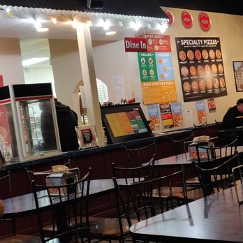 Pier 49 Pizza - Employee sitting on counter. - Pizza Near Me - American Fork, Utah Pier 49 Pizza - Employee sitting on counter. - Pizza Near Me - American Fork, Utah