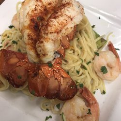 Blue City Grille - Enjoying tonight special lobster tail with shrimp over pasta, join us for good food and wine