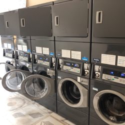 Quickwash - 5 10kg washers and 5 dryers. Instructions in English. Recommend bringing your own coins.