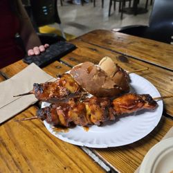 Iguana Restaurant & Bar - Chicken skewers. These are pronounced "pinchos" in Puerto Rico.