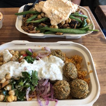 Hummus Mediterranean - Falafel and rice bowl with tabouleh and spicy yogurt sauce. Salad plate with grilled chicken, herbs green beans, spicy feta. - Mediterranean Near Me - Holbrook, New York Hummus Mediterranean - Falafel and rice bowl with tabouleh and spicy yogurt sauce. Salad plate with grilled chicken, herbs green beans, spicy feta. - Mediterranean Near Me - Holbrook, New York