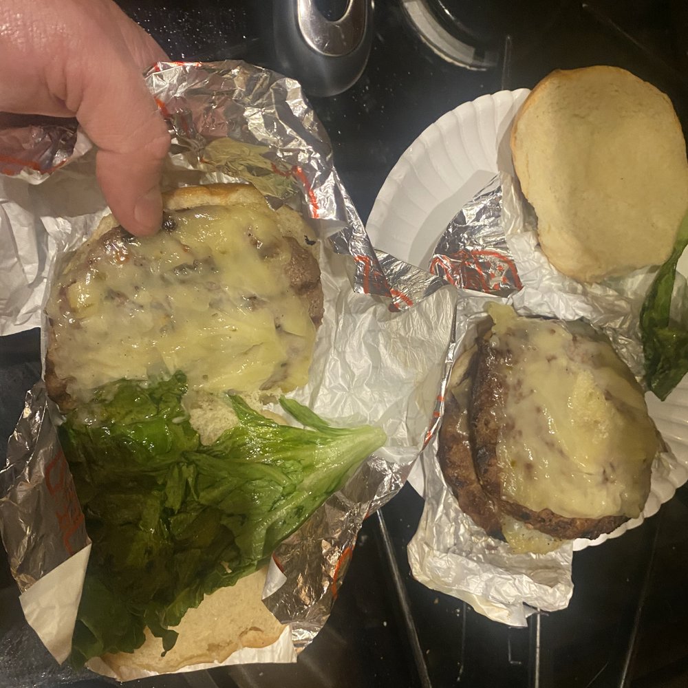 The Burger Experience - Garbage burgers, not made correctly.  One was supposed to be the green Chile burger.  The other customized with everything on it. - Burgers Near Me - Peachtree City, Georgia